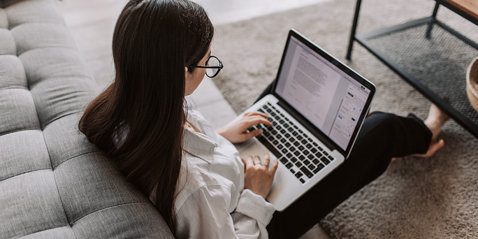 A woman researching "How Long Does an Abortion Take? Timing and Options"