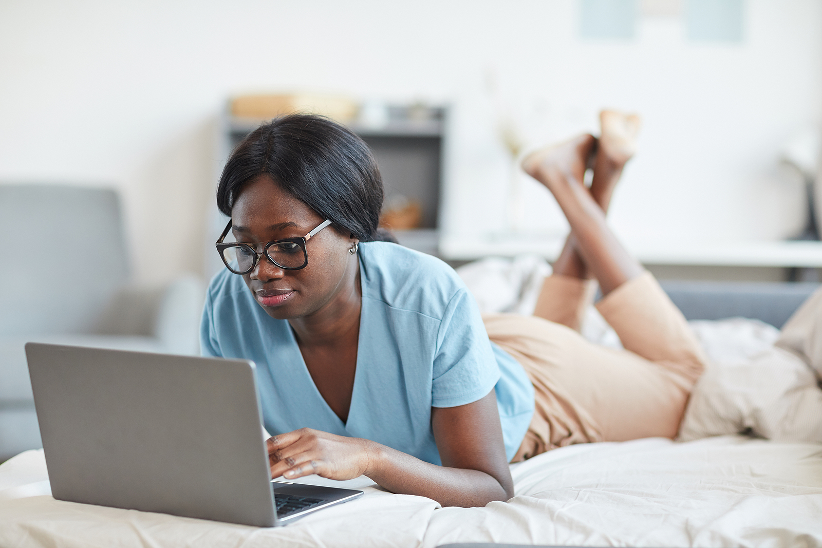 What If You Have Taken Mifepristone and Misoprostol? A woman looking on her computer for what to do for abortion pill reversal if both Mifepristone and Misoprostol were taken.
