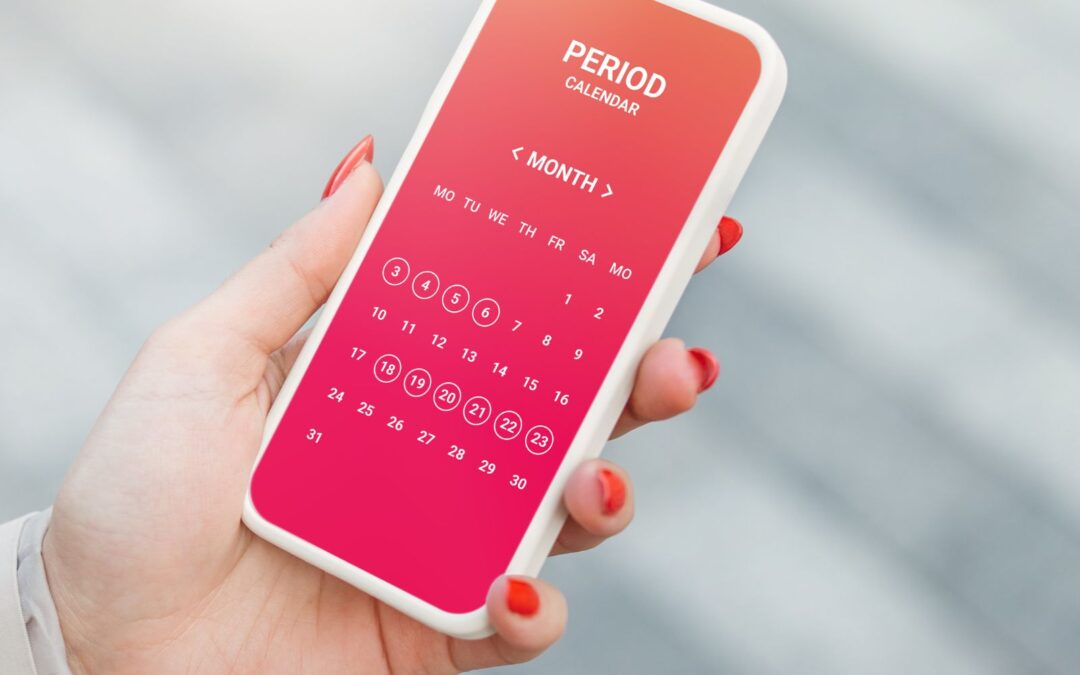 Woman checking her phone to see when she will be on her period.